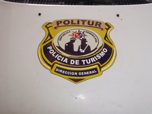 Badge closeup - Policia de Turismo